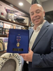 Kevin Kline Holding purple heart